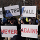 White nationalists hold placards supporting the building of a wall along the U.S.-Mexico border during an anti-immigration rally in front of the White House on Pennsylvania Avenue in Washington, D.C., on Dec. 3, 2017. (Mandel Ngan/Getty Images)